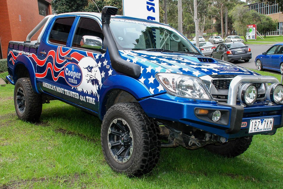 cool vehicle wrap of cooper tires stars and stripes