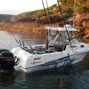 marlin half boat wrap shown on a boat in water